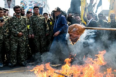 Iranians burn a mask of  President Donald Trump during a protest marking the annual al-Quds Day on the last Friday of the holy month of Ramadan in Tehran, Iran May 31, 2019.