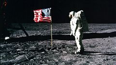 Image: Astronaut Buzz Aldrin salutes the American flag on the surface of th