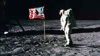 Image: Astronaut Buzz Aldrin salutes the American flag on the surface of th