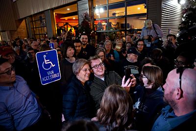 Sen. Elizabeth Warren, D-Mass., takes a selfie with a supporter in Iowa on Jan. 4, 2019.