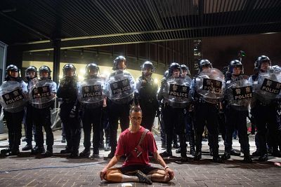 Police gather at a rally in Hong Kong on Monday.