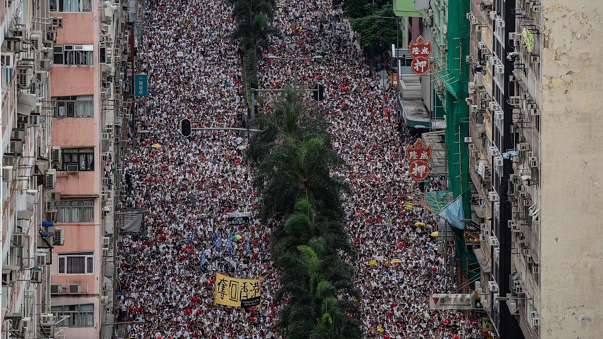 Image: Protesters march during a rally against a controversial extradition 