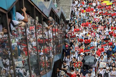 Protesters flood the streets of Hong Kong on Sunday.