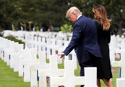 President Donald Trump and first lady Melania Trump react in the Normandy American Cemetery to commemorate the 75th anniversary of the D-Day landings, Normandy, France, June 6, 2019.