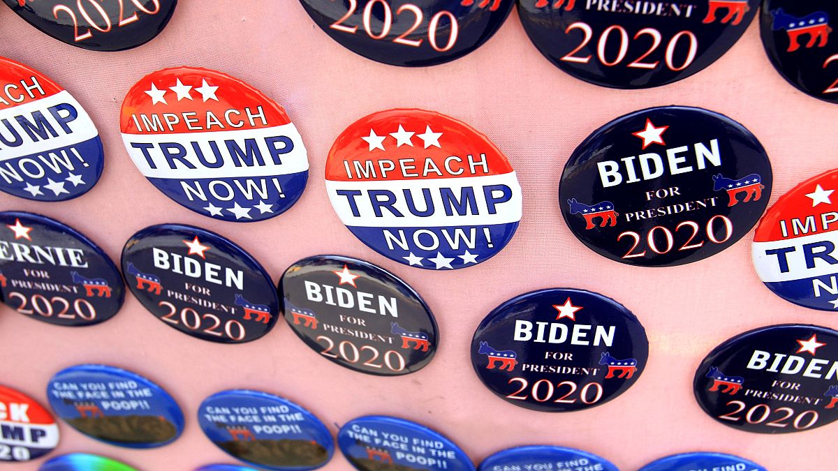 Image: FILE PHOTO: Biden for President campaign buttons and Impeach Trump N