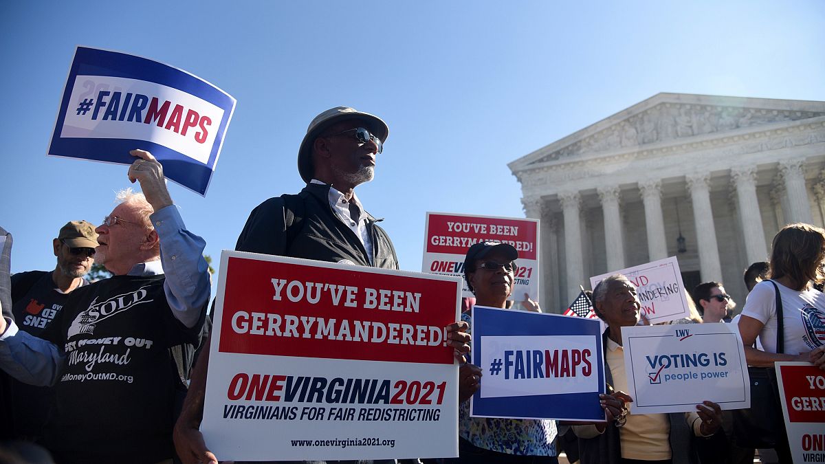 Image: Demonstrators gather outside the Supreme Court during oral arguments