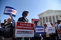Image: Demonstrators gather outside the Supreme Court during oral arguments