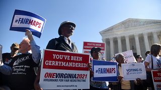 Image: Demonstrators gather outside the Supreme Court during oral arguments