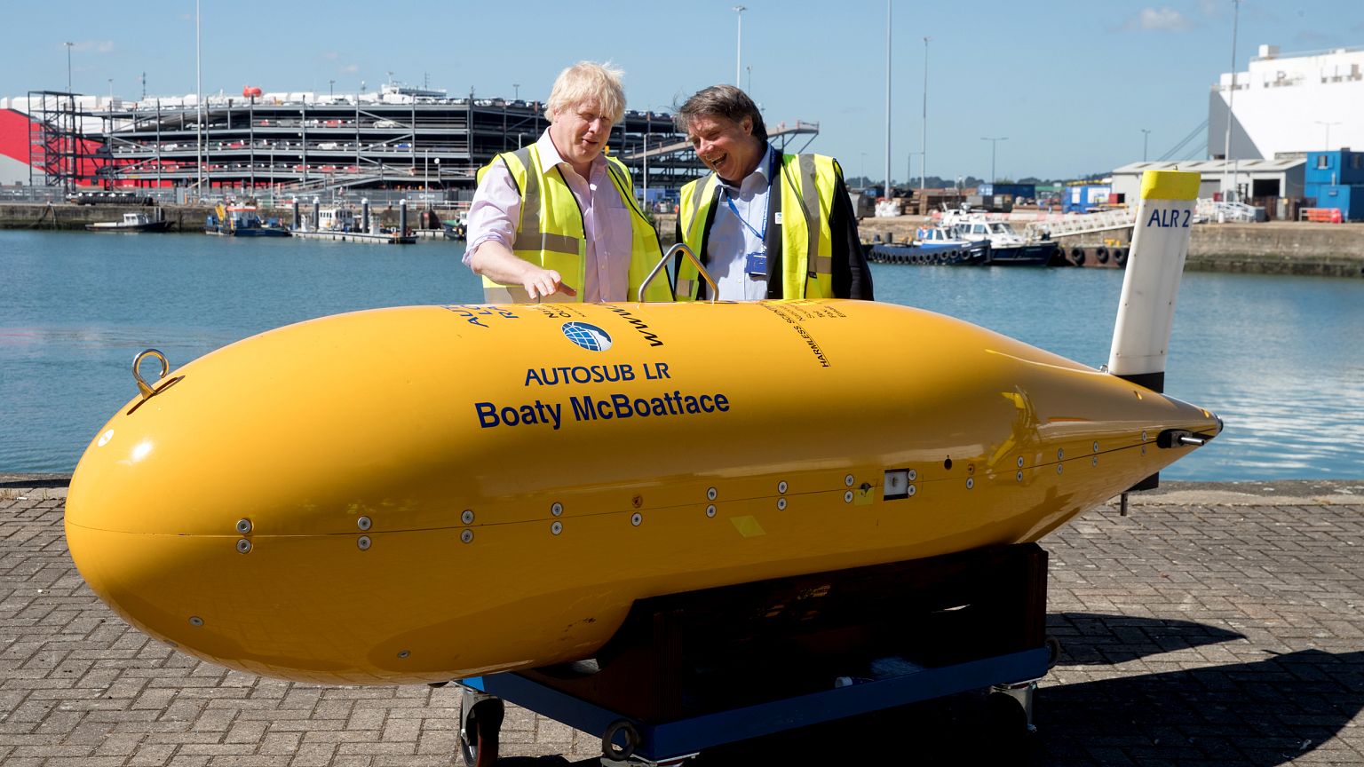 Image: Foreign Secretary Boris Johnson stands with Boaty McBoatface, an aut