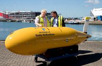 Image: Foreign Secretary Boris Johnson stands with Boaty McBoatface, an aut