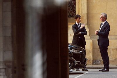 Rory Stewart and Michael Gove talk near the Parliament grounds on Monday.