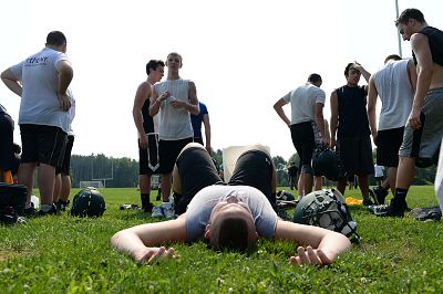 Noah Baker rests as the Schalmont High School varsity football team practices during hot and humid temperatures at Schalmont High School, in Rotterdam, New York on Aug. 18, 2015.