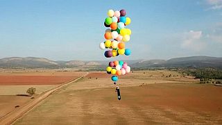 Man flies over South Africa in a chair tied to helium balloons