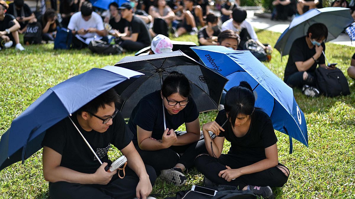 Image: Protesters gather outside the government headquarters in Hong Kong