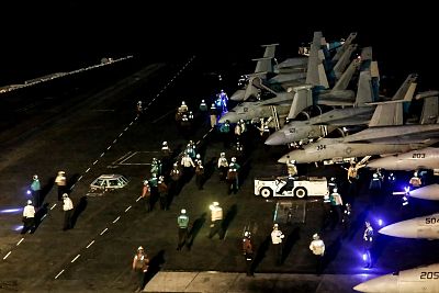 Sailors get ready for flight operations on the deck of the USS Abraham Lincoln in the Arabian Sea on June 14.