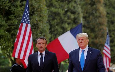 President Donald Trump and French President Emmanuel Macron attend a French-American commemoration ceremony for the 75th anniversary of D-Day at the American cemetery of Colleville-sur-Mer in Normandy, France, June 6, 2019.