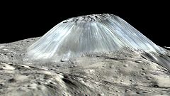 Mystery of dwarf planet's 'lonely mountain' has been solved