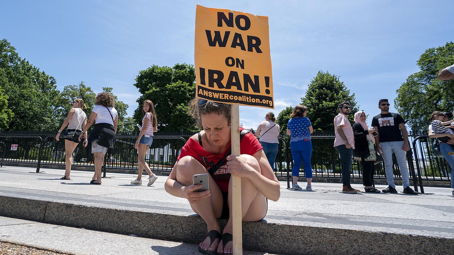 Image: Protesters gather in front of the White House to speak out against a