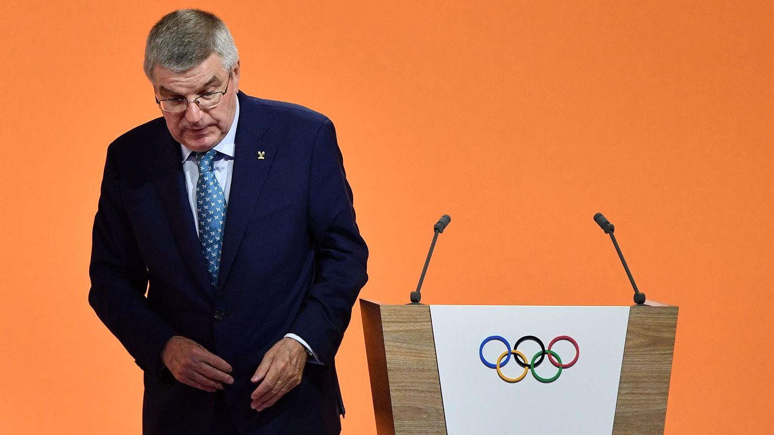Image: International Olympic Committee (IOC) president Thomas Bach leaves t