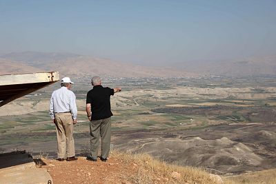 National Security Advisor John Bolton and Israeli Prime Minister Benjamin Netanyahu visit an old army outpost overlooking the Jordan Valley  on Sunday. 