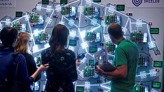Image: People look at visualizations at a cyber defense exercise organize b