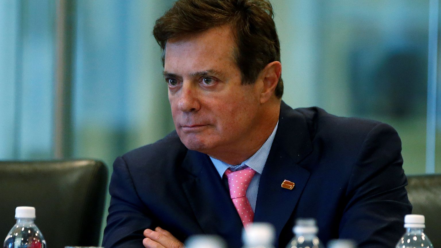 What are the charges against Paul Manafort and Rick Gates?