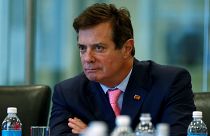 What are the charges against Paul Manafort and Rick Gates?