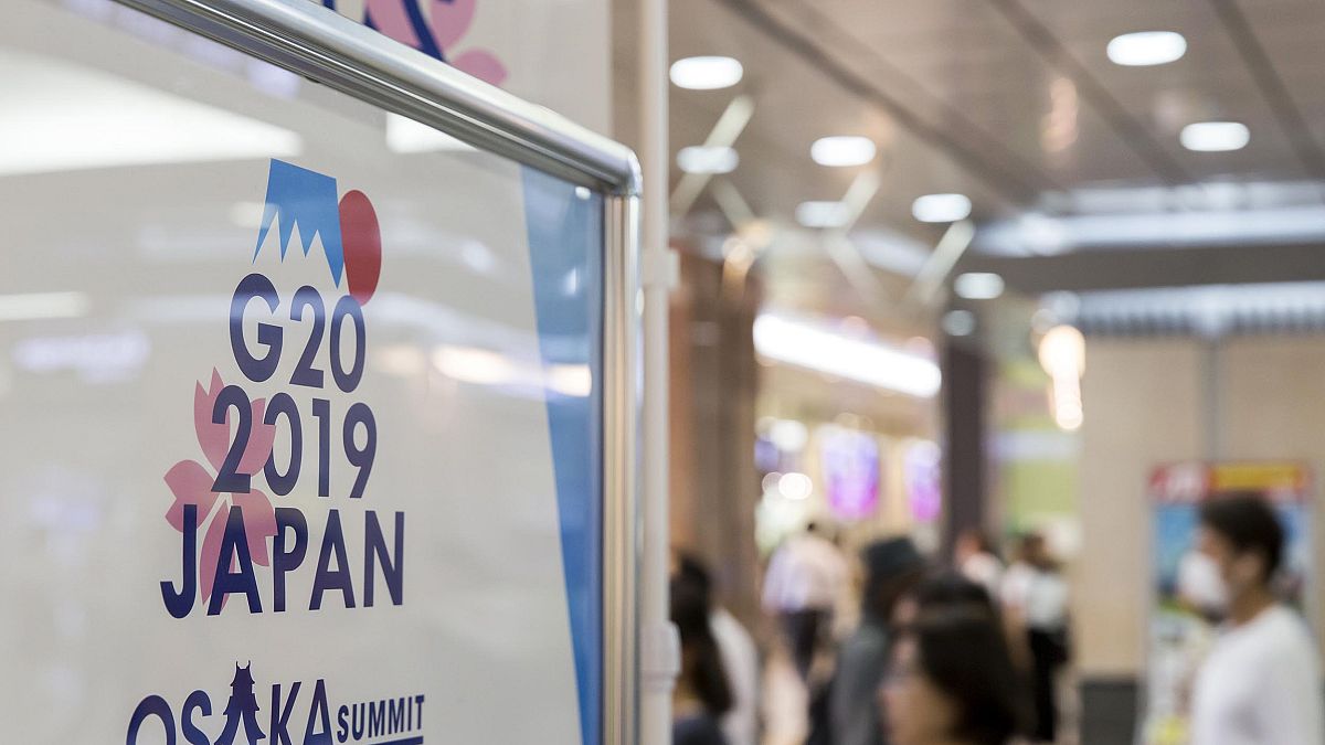 Image: A sign for the G-20 Summit at a train station on June 26, 2019 in Os