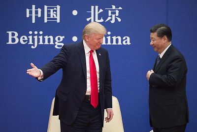 President Donald Trump greets China\'s President Xi Jinping during a business leaders event at the Great Hall of the People in Beijing on Nov. 8, 2017