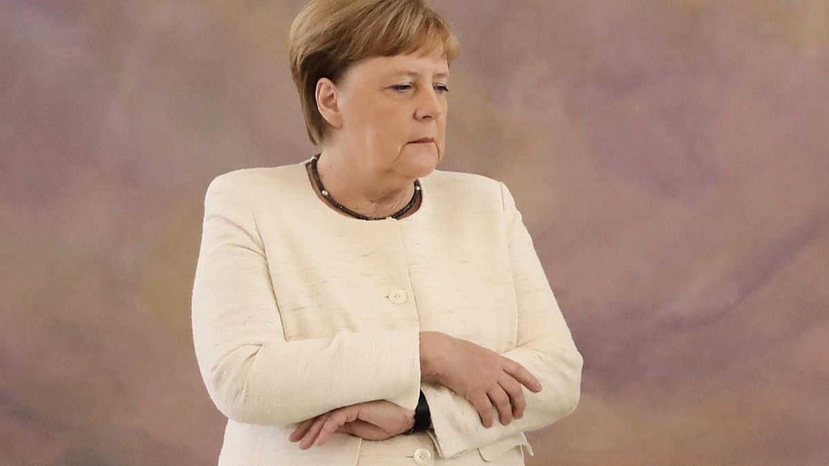 Image: German Chancellor Angela Merkel attends a ceremony at the presidenti