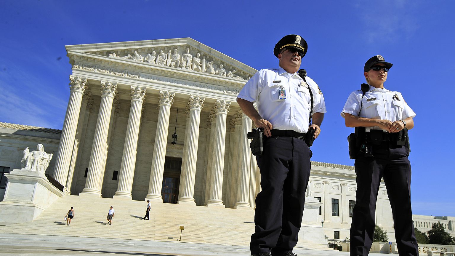 U.S. Supreme Court Police Department officers stand in front of the Supreme