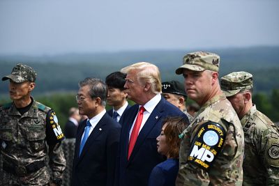 President Donald Trump and South Korean President Moon Jae-in visit an observation post in the Joint Security Area (JSA) at Panmunjom in the Demilitarized Zone (DMZ) separating North and South Korea on June 30, 2019.