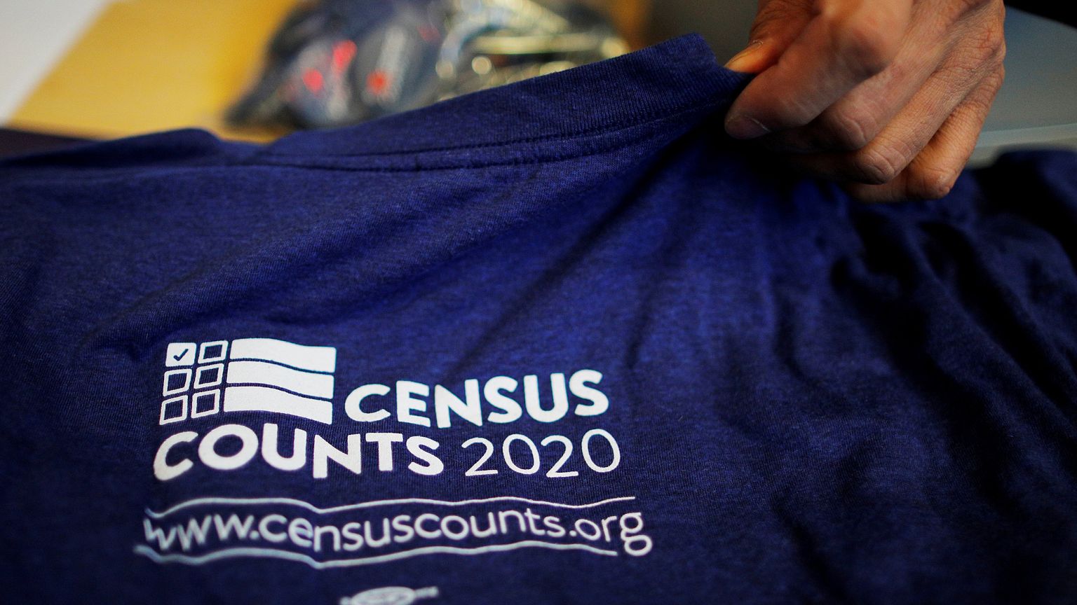 Image: T-shirts are displayed at a community activists and local government