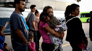 Image: Migrant families are released from detention in McAllen, Texas, on M