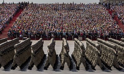 Soldiers march past Tiananmen Square and the Forbidden City during a military parade on Sept. 3, 2015 in Beijing, China.