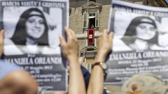 Image: Demonstrators hold pictures of Emanuela Orlandi, as Pope Benedict XV