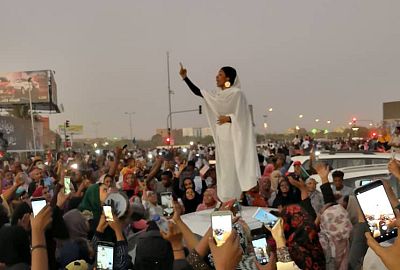 A woman gestures during a protest demanding former Sudanese President Omar Al-Bashir to step down in Khartoum, on April 8.