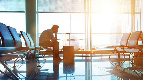 Image: Passenger waits for plane in an airport