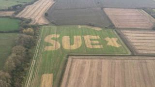 Who is Sue? Message in field sparks hunt for mystery woman
