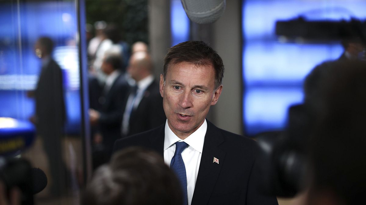 Image: Britain's Foreign Secretary Jeremy Hunt talks to journalists as he a