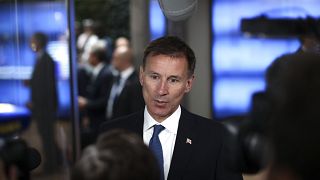 Image: Britain's Foreign Secretary Jeremy Hunt talks to journalists as he a