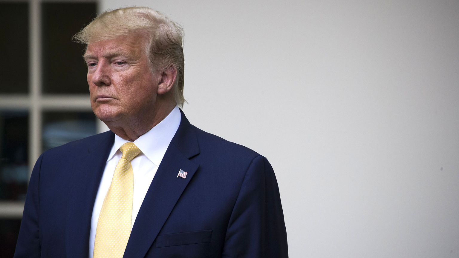 Image: President Donald Trump listens as Attorney General William Barr spea