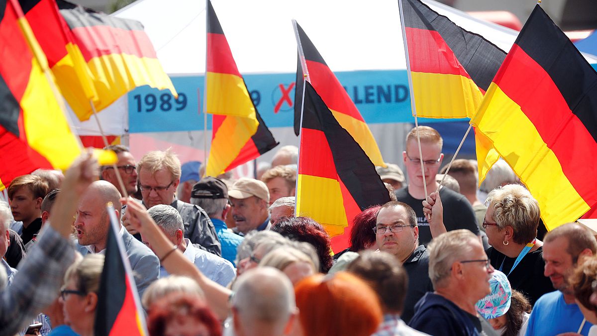 Image: People attend an election campaign event by Germany's far-right Alte