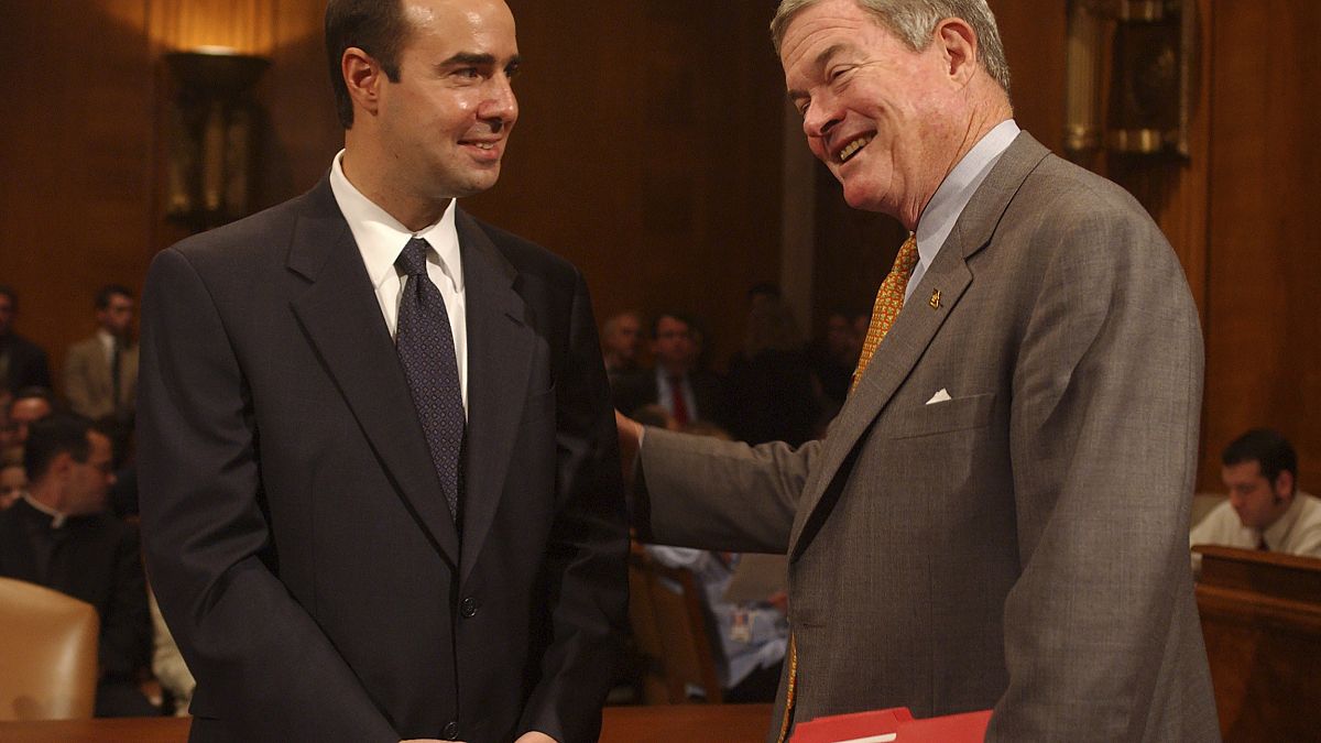 Image: At left, Eugene Scalia, nominee for Solicitor of Labor, gets