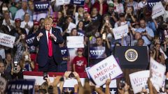 President Donald Trump takes the podium before speaking during a Keep Ameri