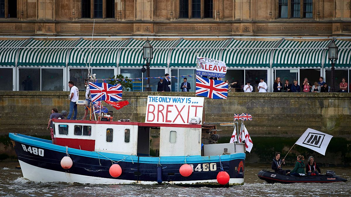 Image: A boat decorated with flags and banners from pro-Brexit Fishing for 