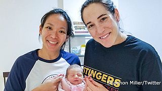 Former international hockey captains have baby