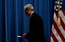 Image: Robert Mueller departs a news conference at the Department of Justic