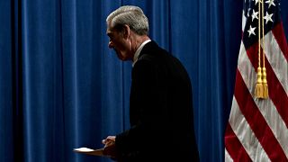 Image: Robert Mueller departs a news conference at the Department of Justic