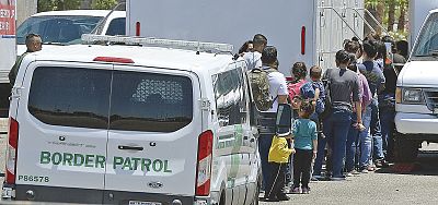 A group departs U.S. Border Patrol vans in Yuma, Arizona, on June 3, 2019.